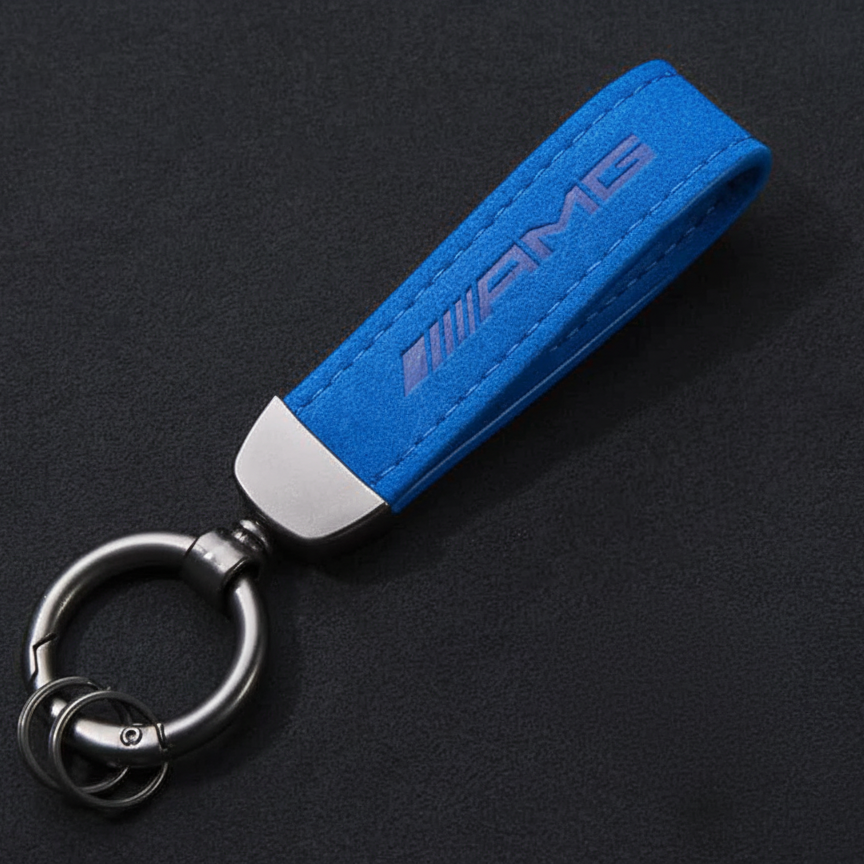 Blue AMG keychain on a black background