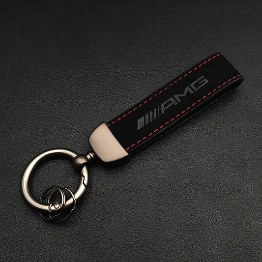 AMG keychain on a black background