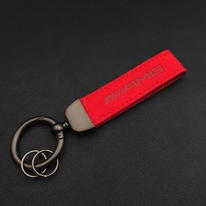 Red keychain with AMG logo on a black background